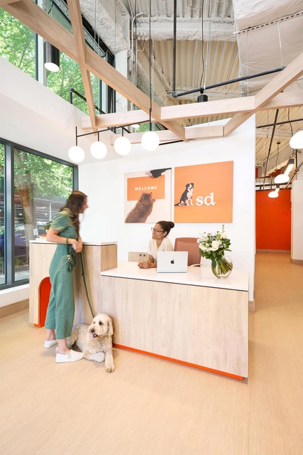 Small Door front desk where a member chats with the receptionist