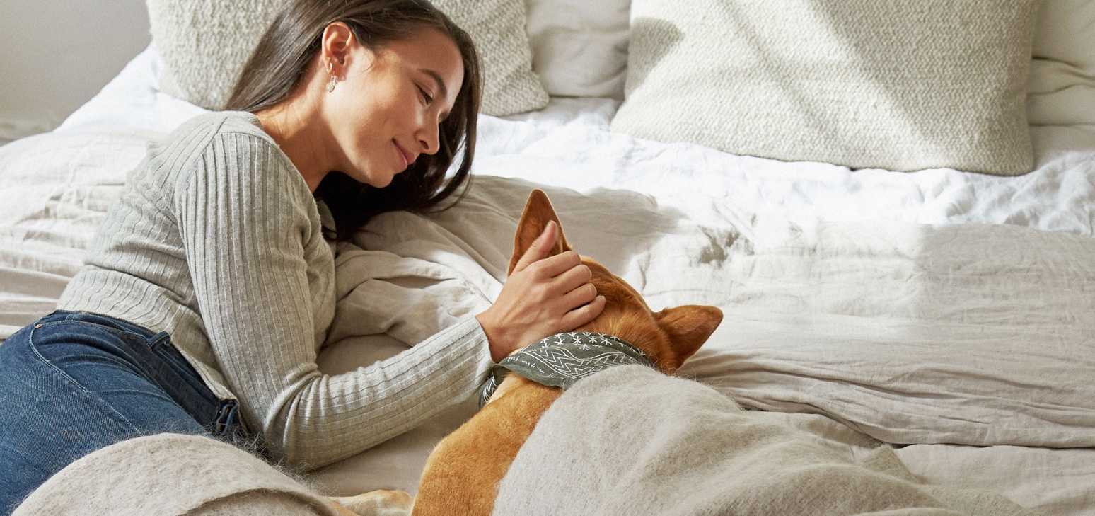 Lady laying down with dog