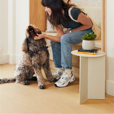 Member with her dog in the lounge area.