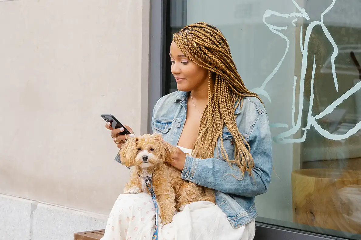 A pet parent texting Small Door's care team